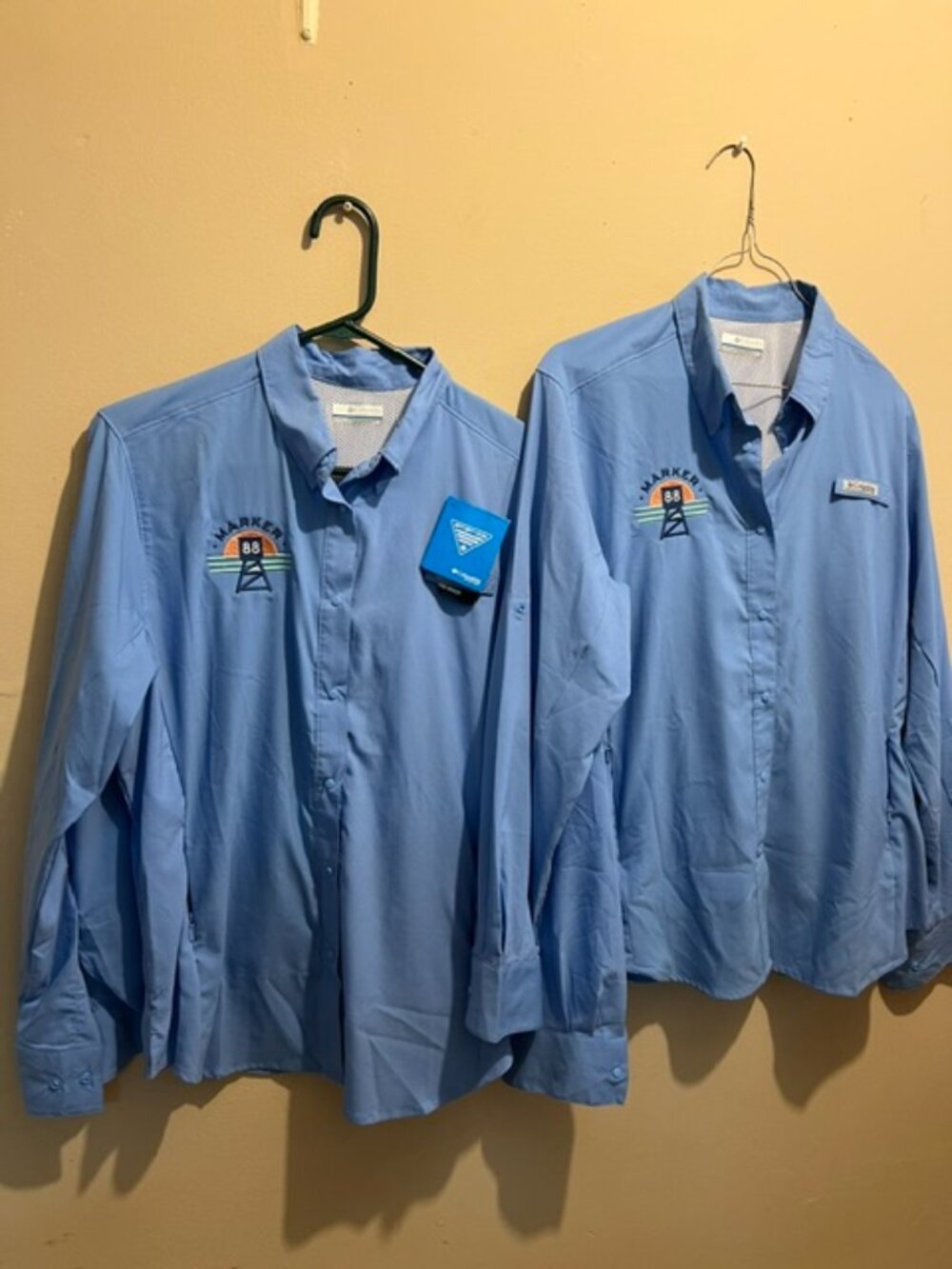 two(2) Columbia, shirts, $5 each, New, price reflects logo embroidered,